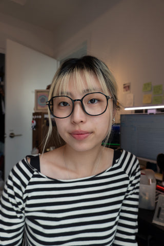 Model wearing EyeCandys Vera Round vintage frames featuring prescription glasses with blue light blocking, transitions, and polarized options