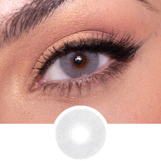 Composite of a brown eye wearing the Dare to be grey color contact lens, above the design file of the contact lens itself.