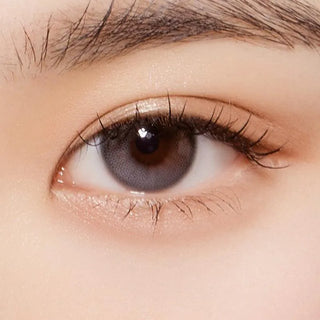 Macro shot of an eye wearing the Olola Daymood 1-Day Grey (10pk) (KR) prescription colour contact lens, showing the multi-colored detail and natural effect on dark brown eyes.