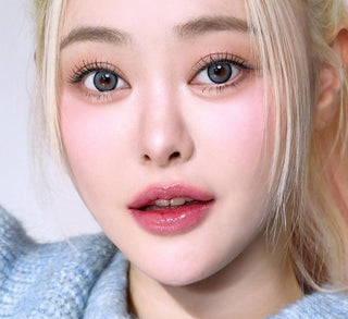 Model showcasing the natural look using i-Sha Dekame Hug Me Grey prescription colored contact lenses, above a closeup of a pair of eyes enhanced and widened by the circle lenses.