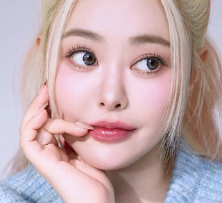 Model showcasing the natural look using i-Sha Dekame Hug Me Grey prescription colored contact lenses, above a closeup of a pair of eyes enhanced and widened by the circle lenses.