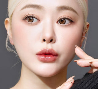 Model showcasing the natural look using i-Sha Dekame Hug Me Taupe prescription colored contact lenses, above a closeup of a pair of eyes enhanced and widened by the circle lenses.