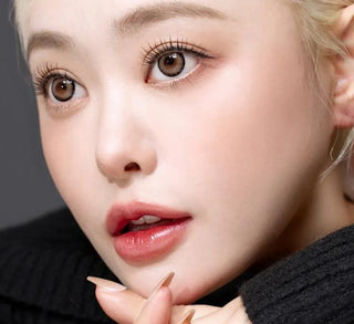 Model showcasing the natural look using i-Sha Dekame Hug Me Taupe prescription colored contact lenses, above a closeup of a pair of eyes enhanced and widened by the circle lenses.