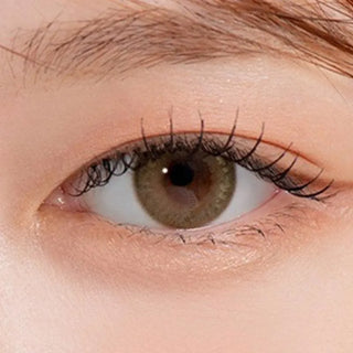 Macro shot of an eye wearing the DooNoon Bono Brown prescription colour contact lens, showing the multi-colored detail and natural effect on dark brown eyes.