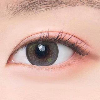Macro shot of an eye wearing the DooNoon Jinju Beads 1-Day Olive (10pk) prescription colour contact lens, showing the multi-colored detail and natural effect on dark brown eyes.