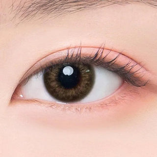 Macro shot of an eye wearing the DooNoon Rona 1-Day Brown (10pk) prescription colour contact lens, showing the multi-colored detail and natural effect on dark brown eyes.