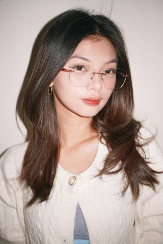 Woman wearing EyeCandys stylish prescription reading glasses with blue light filter. Perfect eyewear for clear vision and reduced eye fatigue.