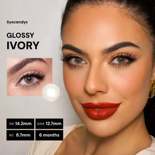 Advertisement for 'Glossy Ivory' eyelashes with a model wearing red lipstick, brand name 'eyecandys' displayed.