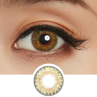 Close-up view of the Pink Label Fresh Look Pure Hazel colored contacts for astigmatism on a woman's dark brown eye, paired with matching simple eye makeup, above a cutout of the color contact lens starburst pattern.