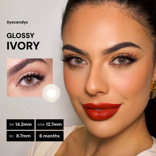 Advertisement for 'Glossy Ivory' eyelashes with a model wearing red lipstick, brand name 'eyecandys' displayed.