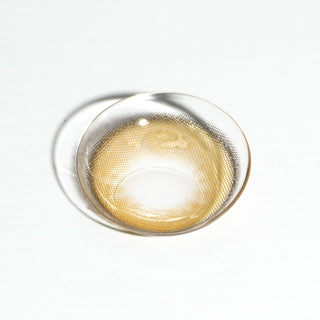 High quality macro shot flatlay of honey donut brown Contact lens in a plain white backdrop showing the details of the lens