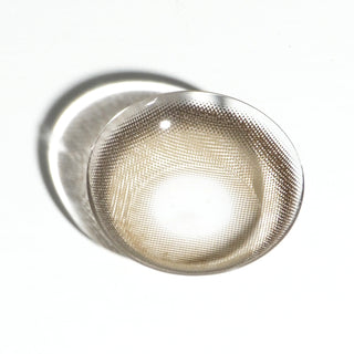 High quality macro shot flatlay of houston brown Contact lens in a plain white backdrop showing the details of the lens