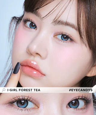 A female model with natural dark eyes wearing i-Girl One Pick Forest Tea  contact lenses, complemented by subtle eyeshadow and peach lip gloss and Close-up image showcases the model's eyes adorned with the same blue-ish green contact lenses