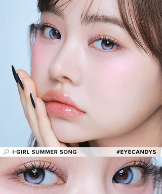 A female model with natural dark eyes wearing i-Girl One Pick Summer Song  contact lenses, complemented by subtle eyeshadow and peach lip gloss and Close-up image showcases the model's eyes adorned with the same blue contact lenses