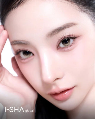Close-up beauty portrait of a woman wearing gray-latte contact lenses with soft makeup.