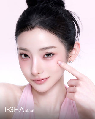 Beauty portrait of a woman wearing gray brown contact lenses, with a clean makeup, and a non-rotating lens design overly with 1-month Reborn branding. 