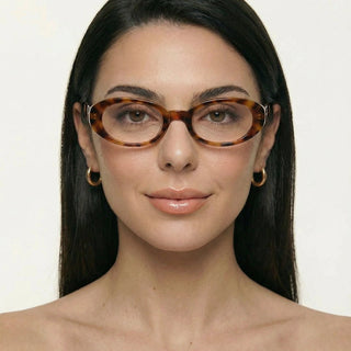 Eyecandys Tortoiseshell Jellicle Oval prescription reading glasses on model, featuring photochromic lenses, trendy full frame eyewear.