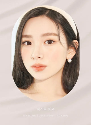 A close-up of a model demonstrating a natural makeup look with Ann365 JUST Choco circle colour contacts, highlighting how well the contact lenses blend with her dark eyes.