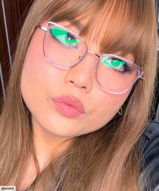 Model wearing Eyecandys Kaylee cat eye Glasses – Stylish cat eye in pink, designed for bold, confident looks, flattering on round and square face shapes.