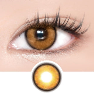 Dark eye with long wispy lashes wearing Eyecandys PowerGlow Brown prescription colored lens