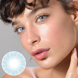 Portrait of a woman wearing natural blue eye contacts on light eyes
