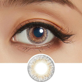 Close-up shot of model's eye adorned with Lilmoon Monthly Cream Grege (Prescription) color contact lenses prescription, paired with clean-girl eye makeup, showing the brightening and enlarging effect of the circle contact lens on dark brown eyes, above a cutout of the contact lens with limbal ring on a white background.