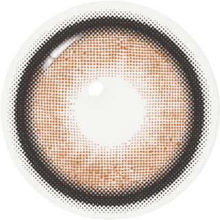 A single i-Sha Dekame Love Me Toffeenut Brown contact lens by i-Sha, featuring a dotted pattern and dark limbal ring, is displayed against a white background to highlight the refined elegance of Japanese colored lenses.