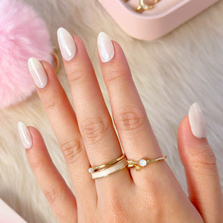 Hand with EyeCandys Lychee Gel nail stickers applied, showcasing a soft cream color. Ideal for elegant, neutral manicures, providing long-lasting wear, easy application, and a smooth, salon-quality gel finish for perfectly polished nails.