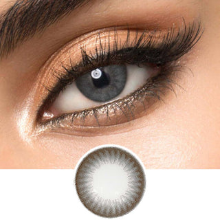 Composite of an Asian eye wearing a dark grey color contact lens on top of a dark brown eye, on top of the design file of the contact lens itself.