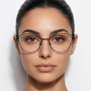A woman with dark hair pulled back wears EyeCandys' Madame Cat Eye lightweight metal frames. She has clear skin, natural makeup, and looks directly at the camera against a plain white background.