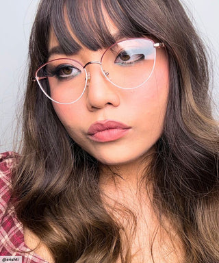 Model wearing Eyecandys Madame cat eye Glasses – Stylish cat eye in pink, designed for bold, confident looks, flattering on round and square face shapes.