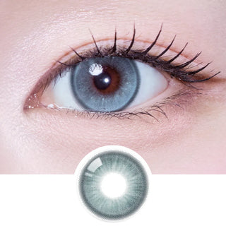 Macro view of eye wearing EyeCandys Olola Meow Scottish Green lens, highlighting vibrant green color and lens pattern.