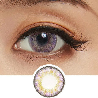 Close-up of an eye with long lashes wearing NEO Vision Cosmo Violet circle lenses by NEO Vision, featuring a purple and yellow patterned design. Below is an enlarged image highlighting the lens' vivid colors and unique pattern.