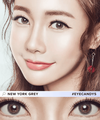 Asian model with brown hair showcasing Limited Edition Pink Label New York Grey contact lenses on naturally dark eyes, with a close-up of her eyes adorned with the same lenses.
