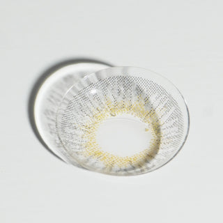 High quality macro shot flatlay of EyeCandys Pink Label New York Grey Contact lens in a plain white backdrop showing the details of the lens