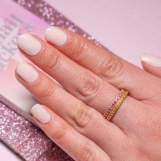 Hand with EyeCandys Nudist Gel nail stickers applied, featuring a chic nude color. Perfect for elegant, minimalist manicures, offering long-lasting wear, easy application, and a smooth, salon-quality gel finish for flawless nails.