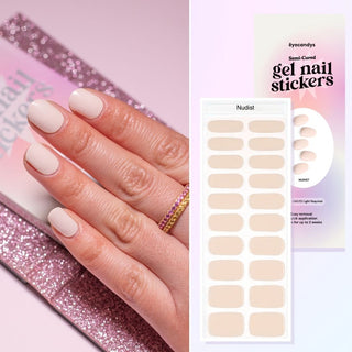 Hand with EyeCandys Nudist Gel nail stickers applied, featuring a chic nude color. Perfect for elegant, minimalist manicures, offering long-lasting wear, easy application, and a smooth, salon-quality gel finish for flawless nails.