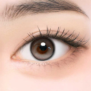 Close-up of model's eye wearing EyeCandys ONE PICK Balance Grey Whisper prescription contact lens, enhancing eye color with a subtle grey shade for a natural look, clear vision, and comfortable wear