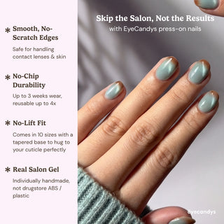 Hand wearing EyeCandys Blue Hour Latte press on nails with milky blue tone, glossy finish, and soft cat-eye effect.