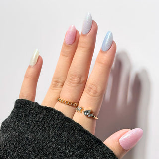 Model's hand showcasing EyeCandys Pearl Skittles Gel Nail Stickers. These vibrant, pearl-colored stickers offer a fun and stylish look, providing a long-lasting, chip-free finish for effortless, eye-catching nail art.