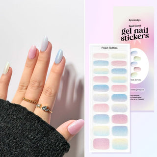 Model's hand showcasing EyeCandys Pearl Skittles Gel Nail Stickers. These vibrant, pearl-colored stickers offer a fun and stylish look, providing a long-lasting, chip-free finish for effortless, eye-catching nail art.