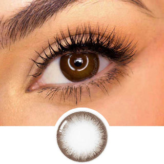 Pink Label Pointe Choco color contact lens on top of a dark eye paired with subtle eye makeup and curled wispy eyelashes, above the contact lens design.
