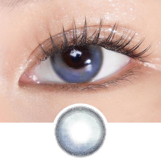Close-up of eye with long lashes wearing EyeCandys Sunlit Deep Blue colored prescription contact lens – rich deep blue tones enhance iris with subtle enlargement. Lens design shown below for color and pattern detail.