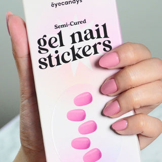 Model's hand holding the EyeCandys Gel Nail Sticker box, showcasing the stylish, easy-to-use design. Perfect for a quick, chip-free manicure, the set includes all the essential tools for flawless nails