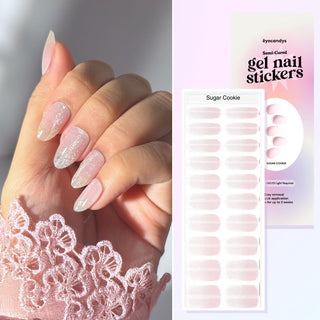 Hand showing Eyecandys Sugar Cookie Gel Nail Stickers, providing a quick 10-minute application, 2-3 weeks of wear, and a safe, odor-free formula for stronger nails