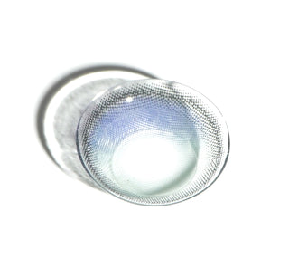 High quality macro shot flatlay of EyeCandys Sunlit Deep Blue Contact lens in a plain white backdrop showing the details of the lens