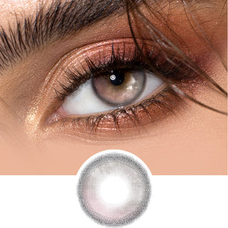 EyeCandys Sunlit Pink-Brown color contact lens worn on dark eyes, with rose gold shimmery eye makeup, on top of the contact lens design