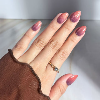 an image of hand model wearing eyecandys gel nail stickers. 