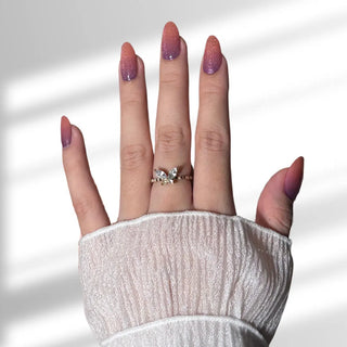 Hand showcasing EyeCandys Sunset Sangria Gel Nail Stickers, featuring vibrant autumn-inspired colors for DIY cozy fall nails.