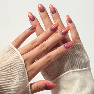 Close-up of hand with EyeCandys Sunset Sangria Gel Nail Stickers, perfect for cozy autumn-inspired DIY manicures.